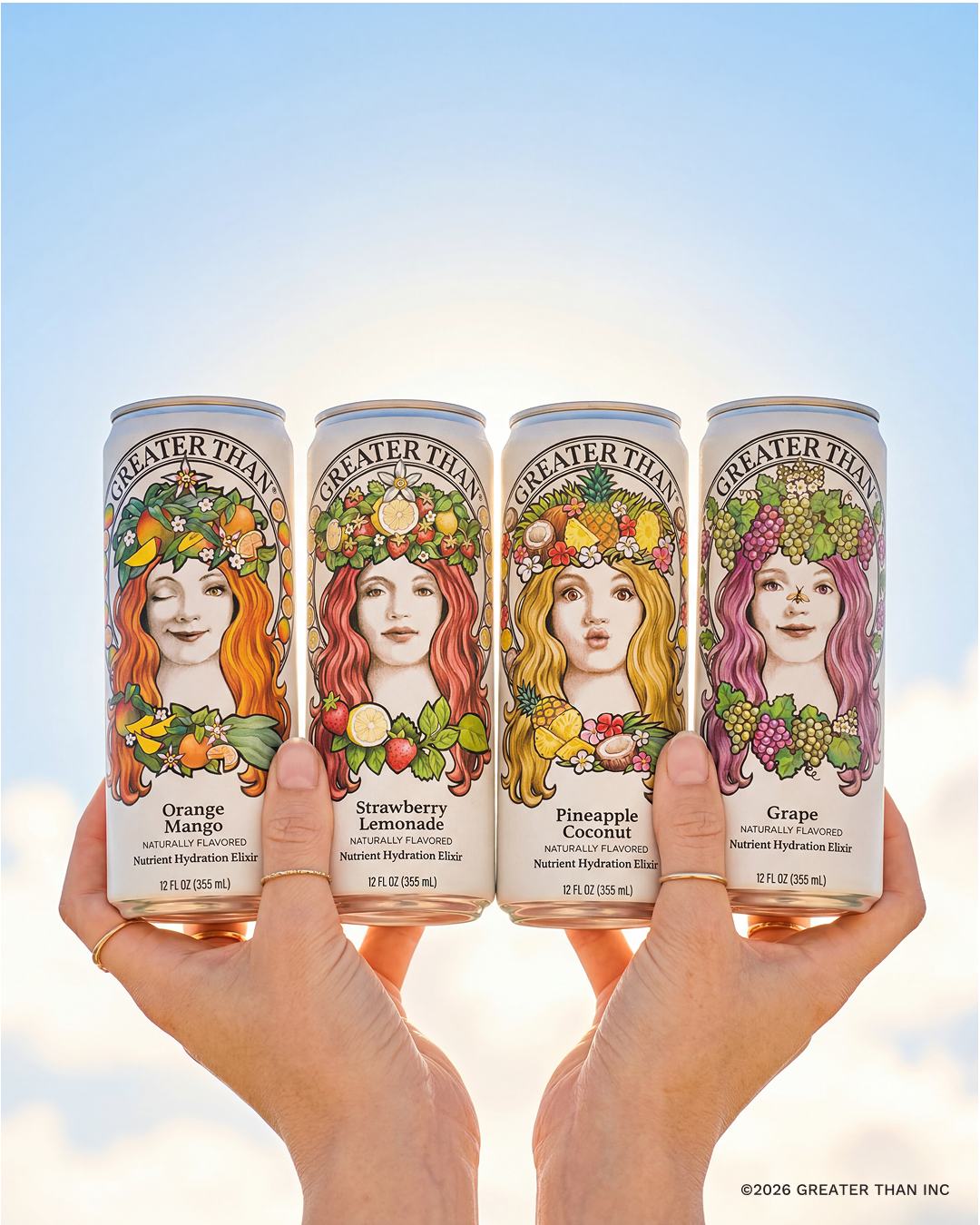 Four GREATER THAN cans held up against a blue sky