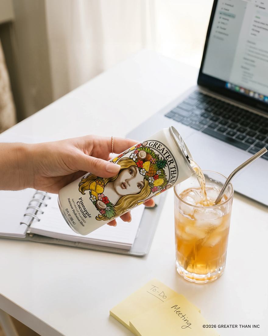 Pouring GREATER THAN into a glass at a desk
